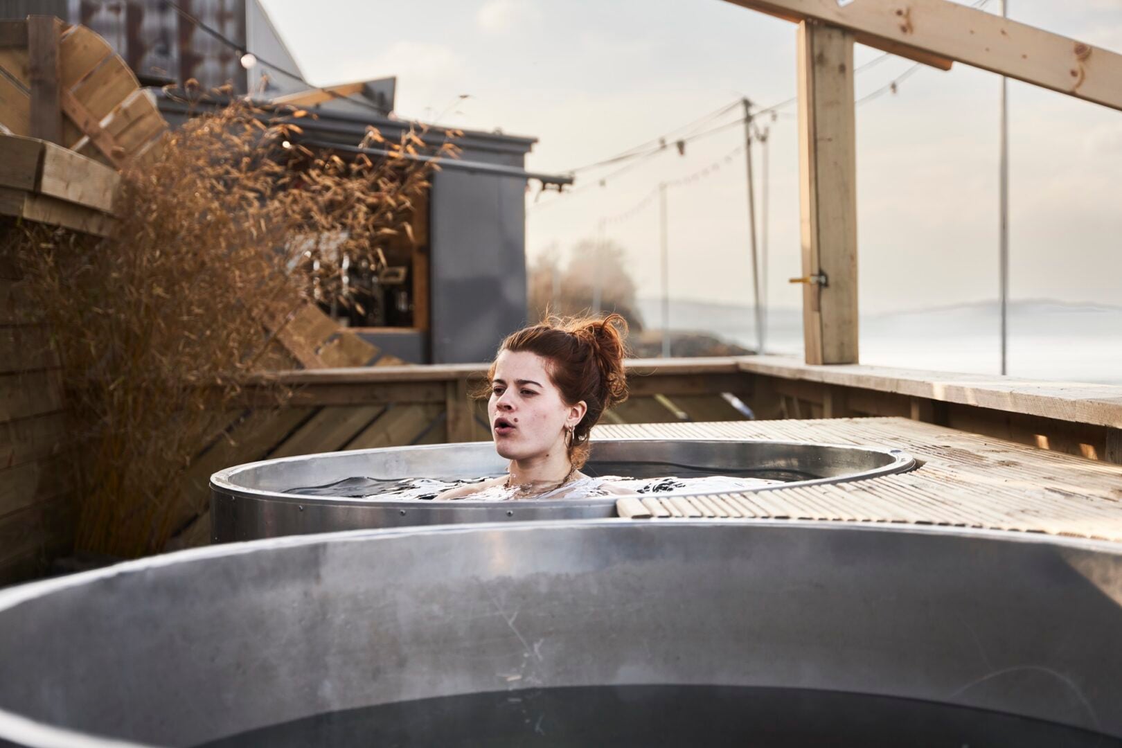 A lady in a cold water plunge bath at The Pitt
