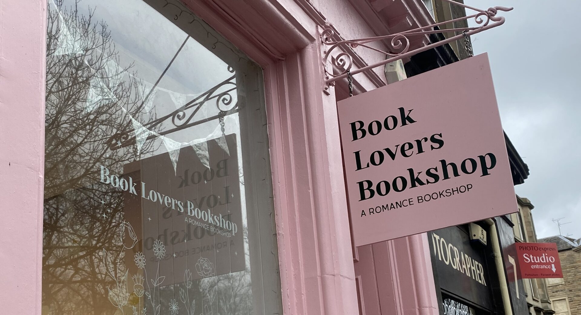 Exterior of Book Lovers Bookshop with sign saying Romance Bookshop