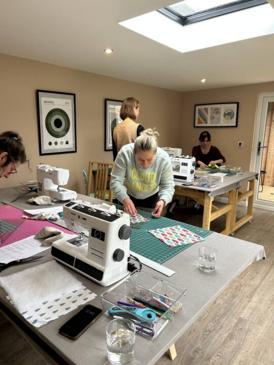 people taking part in a sewing class with Joppa Sewing School
