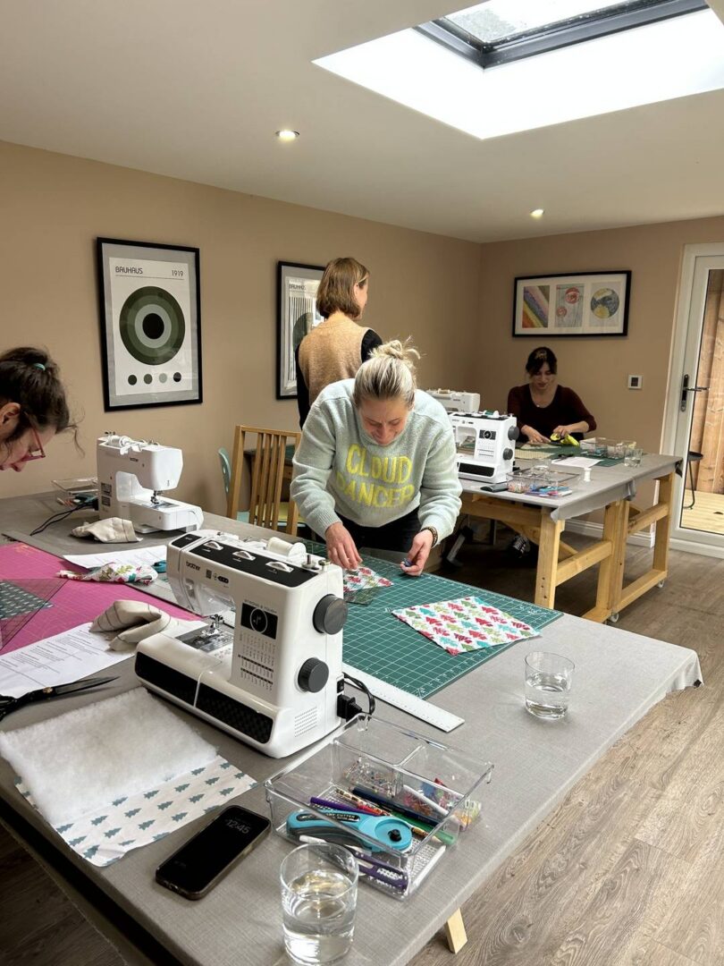 people taking part in a sewing class with Joppa Sewing School