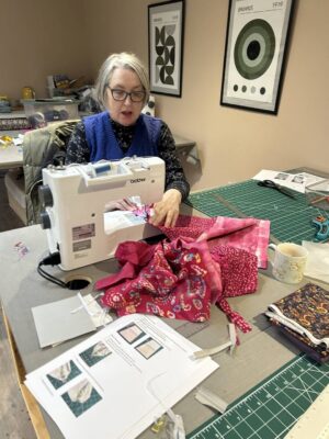 Lady using sewing machine at Joppa Sewing School