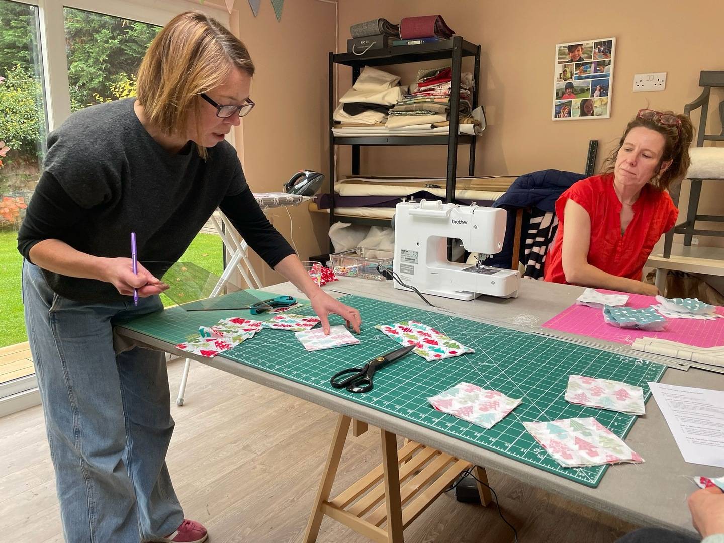 Lady cutting fabric at Joppa Sewing School