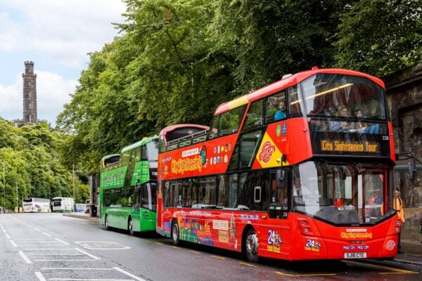 CitySightseeinf Edinburgh bus stopped in front of The Edinburgh Tour bus at Waterloo Place,© Edinburgh Bus Tours