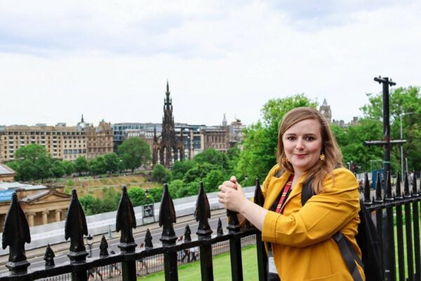Travel Kat Tours owner at the mound with image of Scott Monument