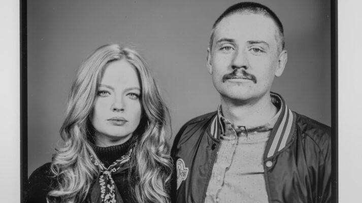 A couple posing for a portrait image