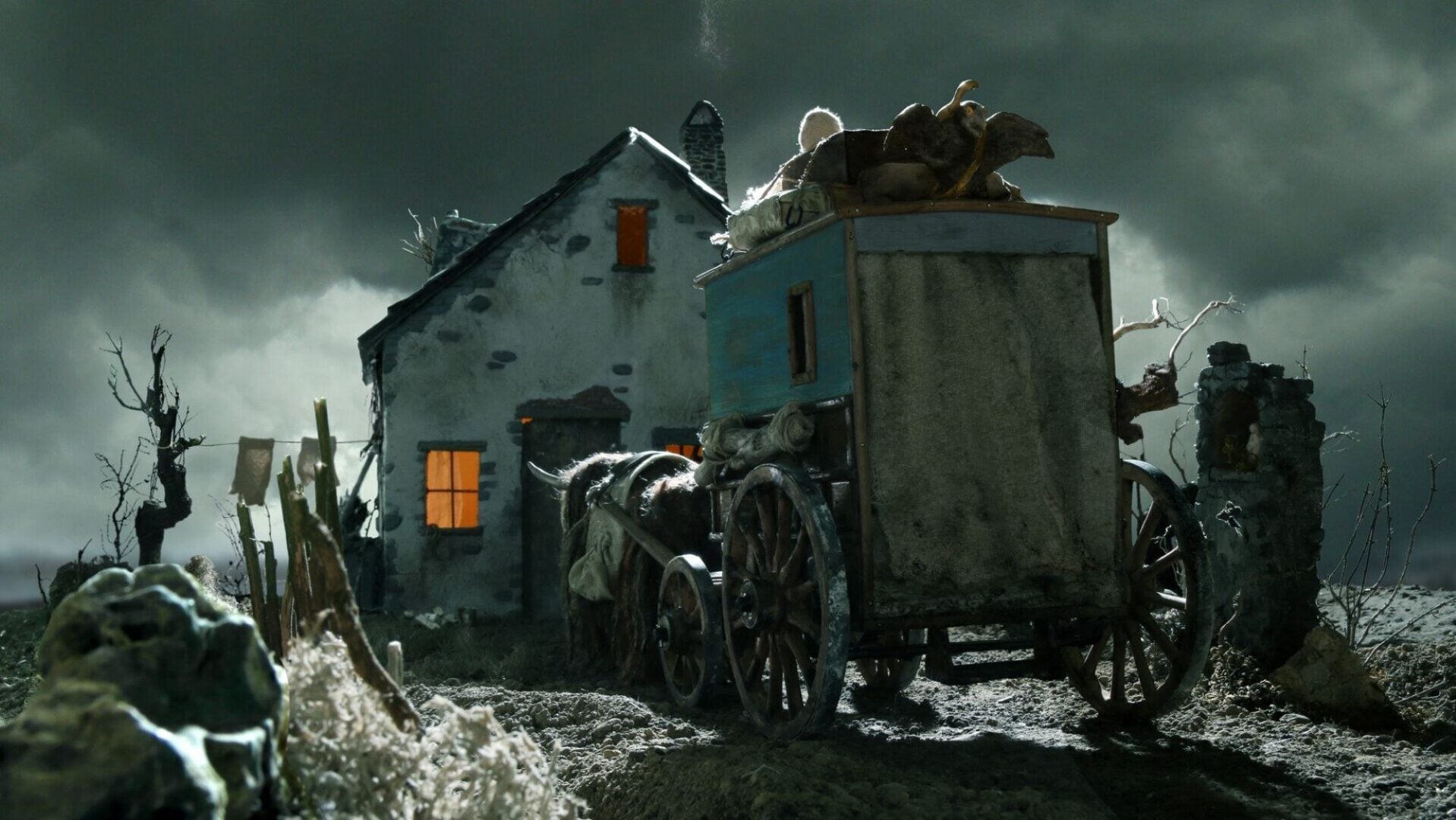 A model house with a model carriage with spooky lighting