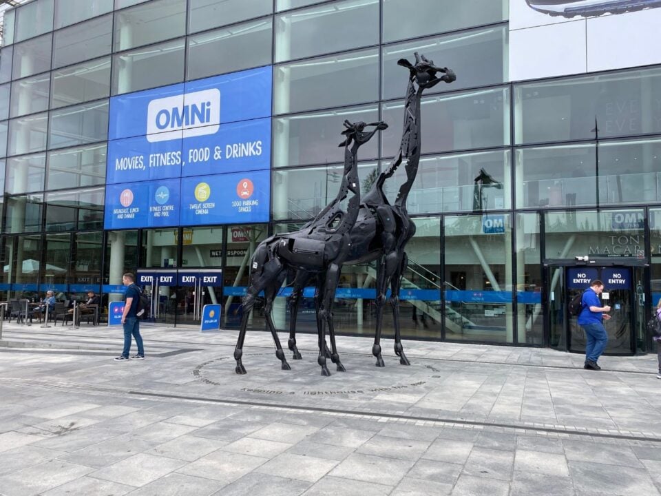 2 metal sculpted giraffes outside OMNI shopping centre.