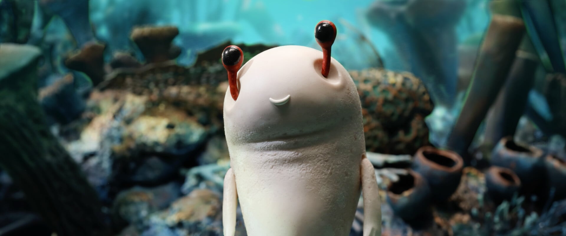 An animated sea creature, with long brown antennas.