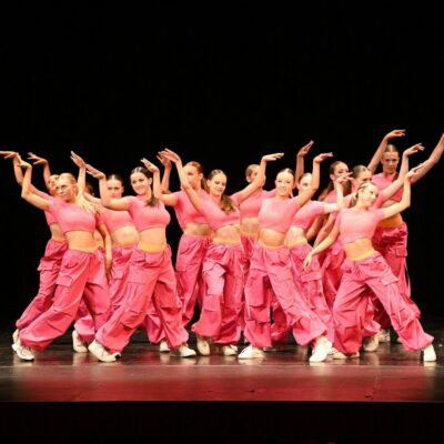 Teenage students taking part in an energetic dance class at DN Dance in Edinburgh, focusing on movement, technique, and confidence-building in a supportive studio environment.,© Copyright 2022 DN Dance (Dynam-nic Dance Limited). Registration No: SC511081