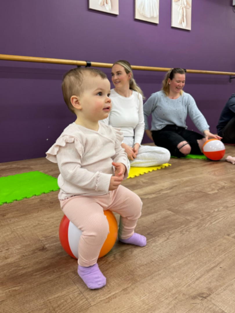 Baby student observing and engaging in an early dance class at DN Dance in Edinburgh, experiencing movement, rhythm, and a calm, supportive studio environment.,© Copyright 2022 DN Dance (Dynam-nic Dance Limited). Registration No: SC511081