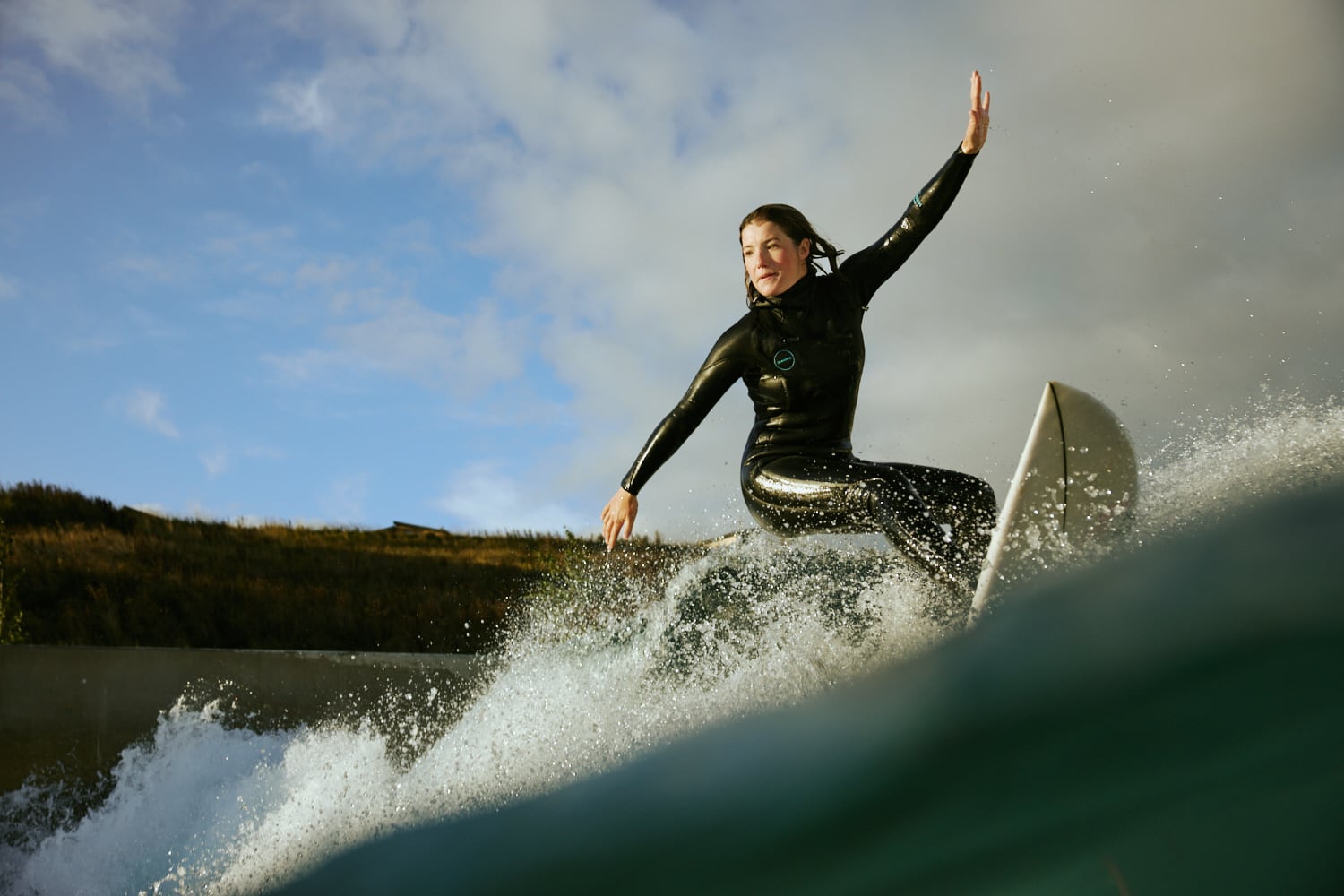 Lady surfing at Lost Shore Resort