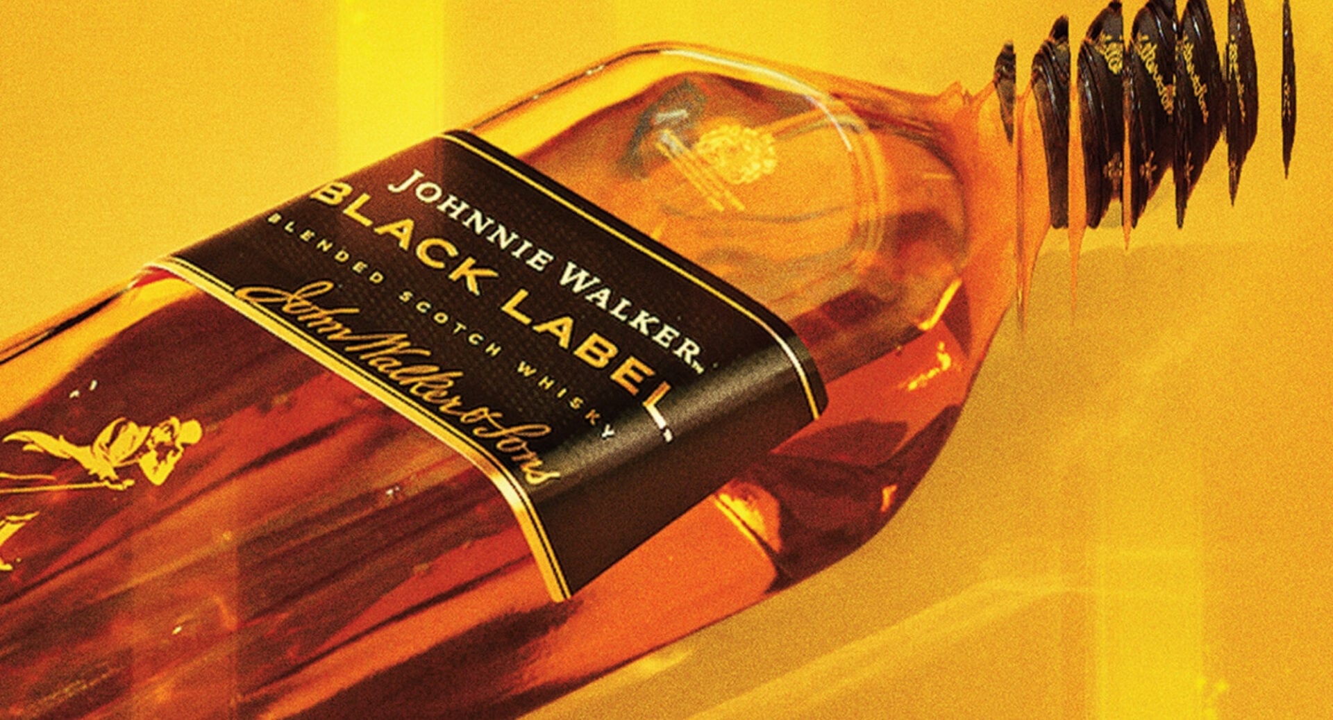 Close-up of a bottle of whisky, lying on its side.