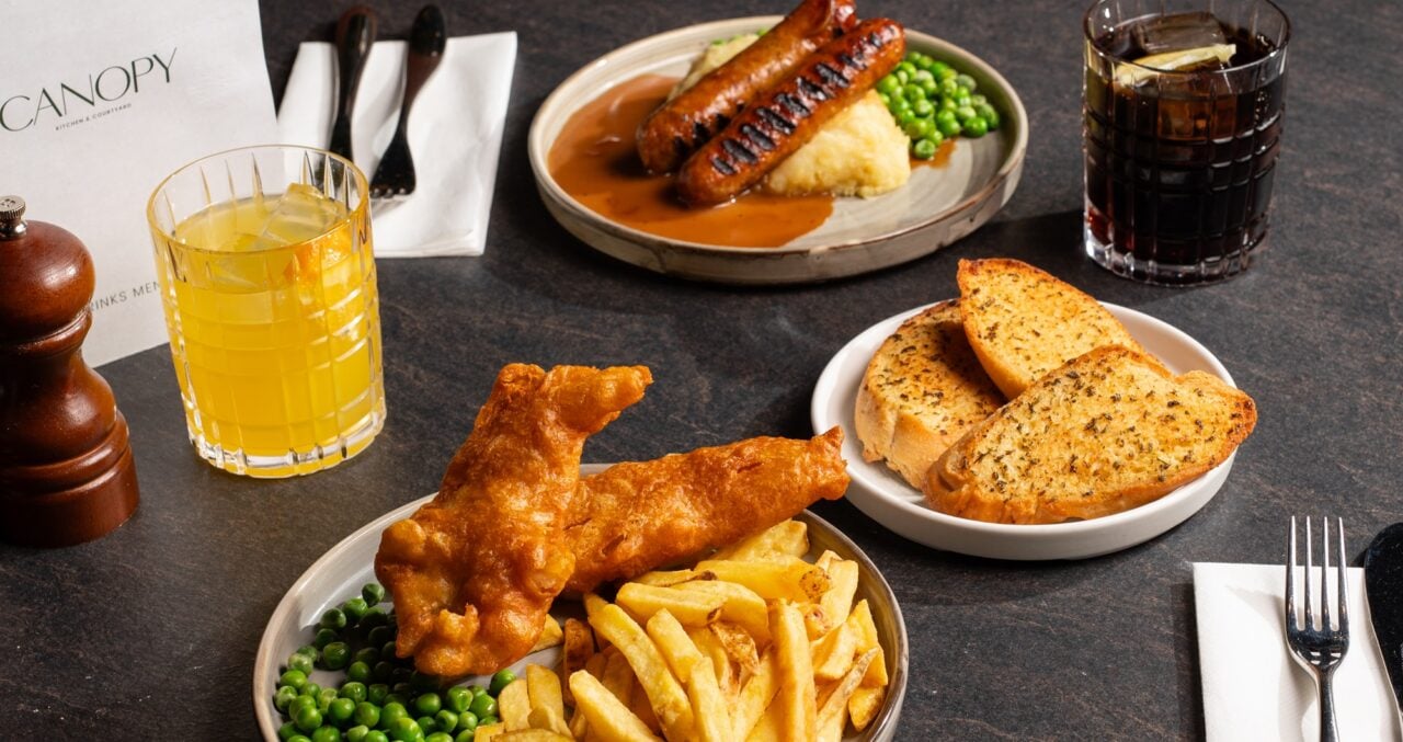Canopy Kitchen table set for 2 people eating from Kids Eat free menu.