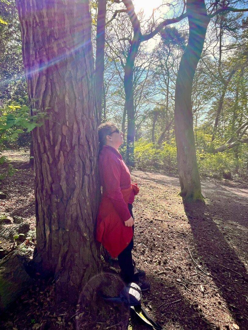 Lady leaning against a tree at Corstorphine hill
