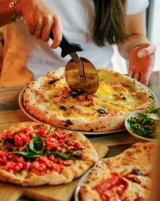 Pizza being cut at Salerno