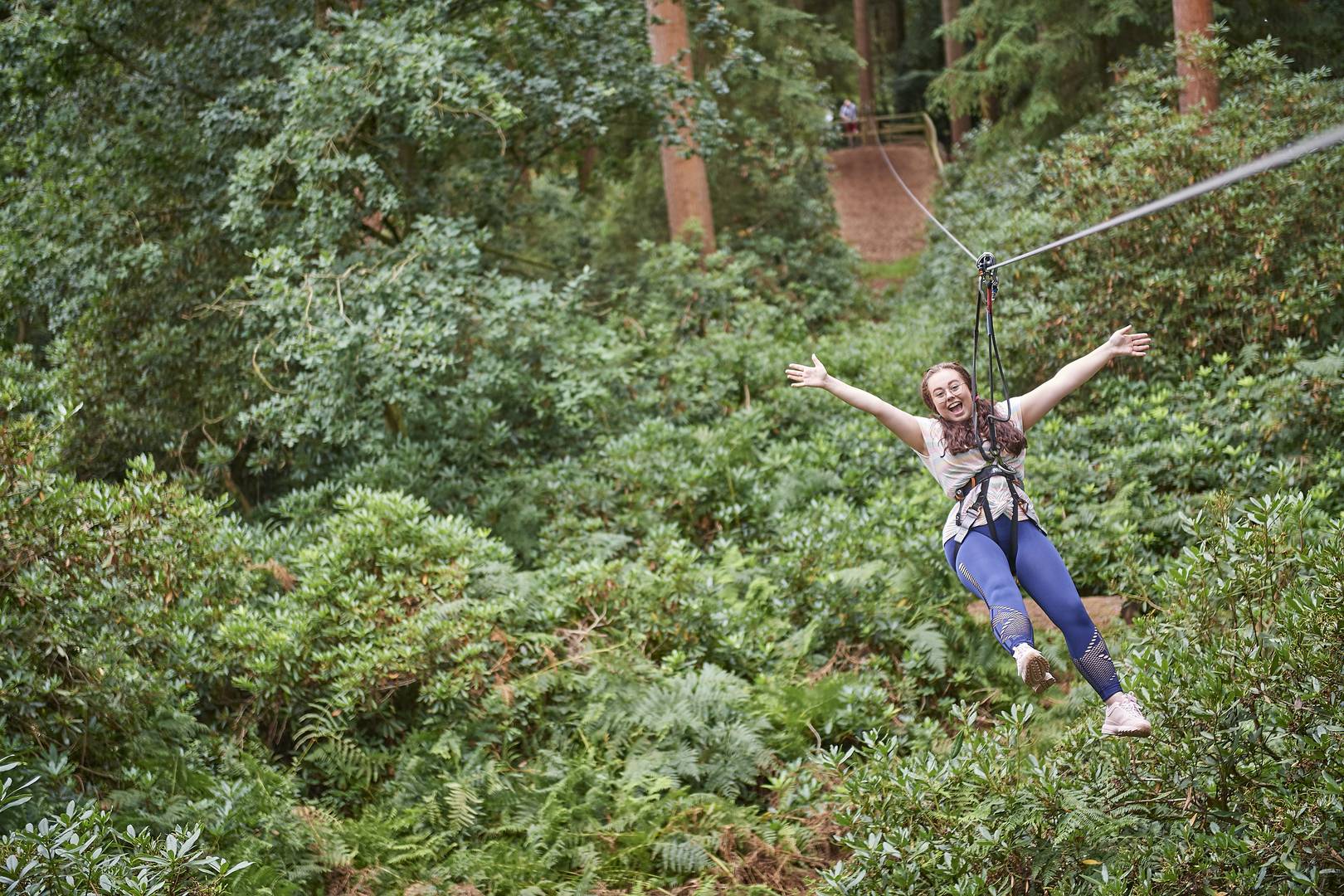 Girl on a zip line at Go Ape