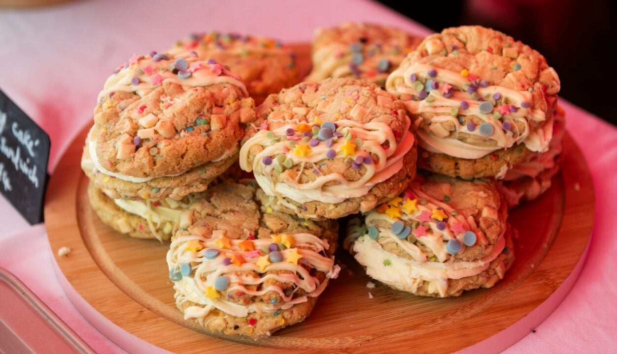 A plate of biscuits, covered in multi-coloured sparkles.