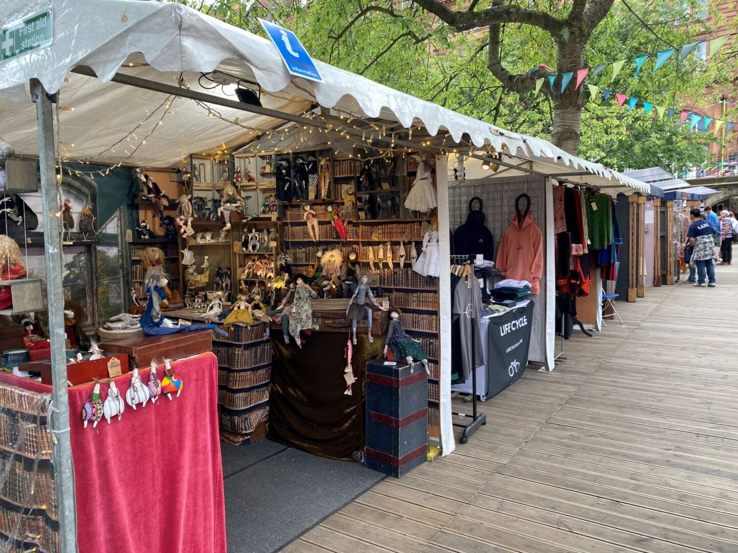 Open-air stalls, showing a variety of items for sale.