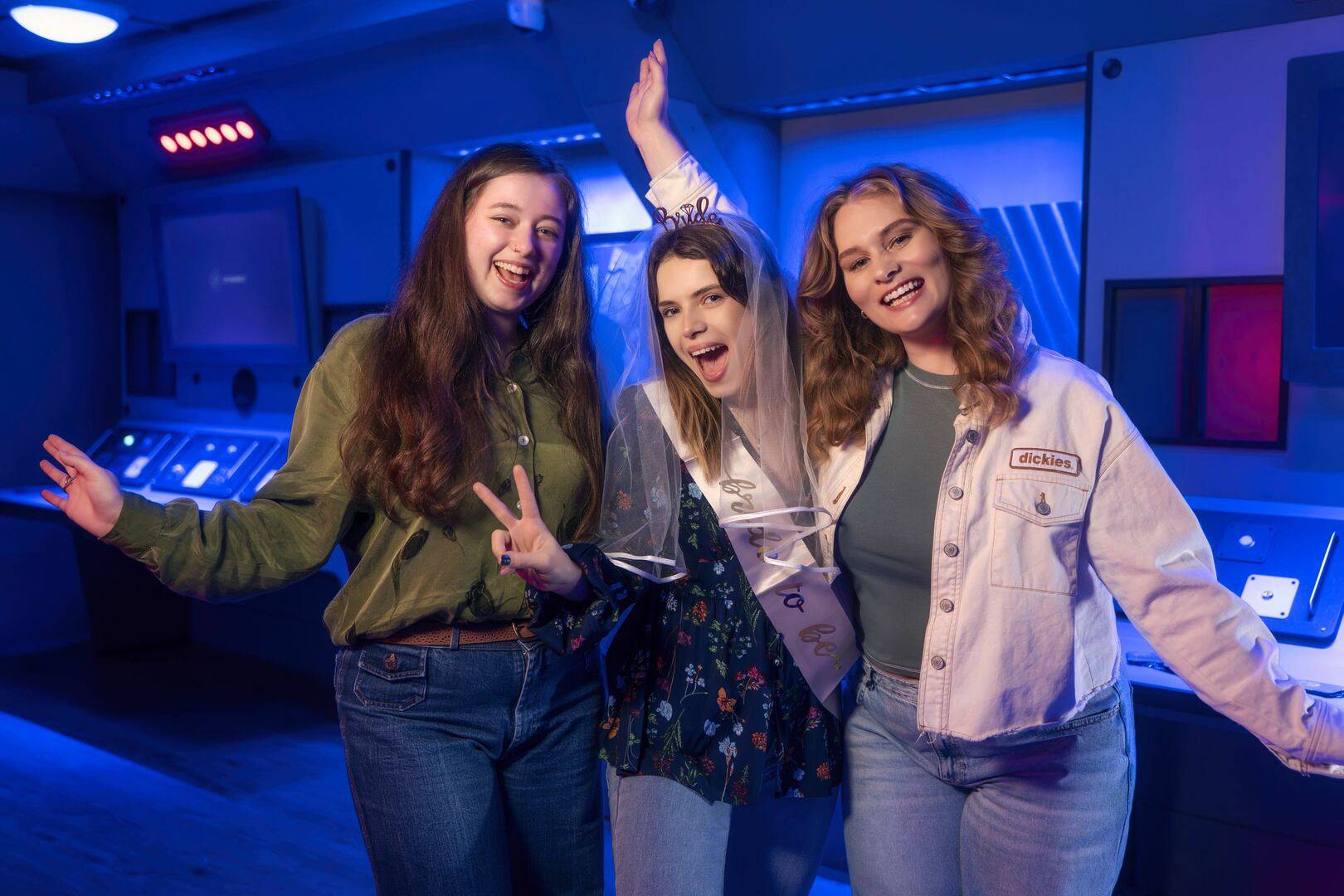 group of young people trying to solve Team Machine escape room problem