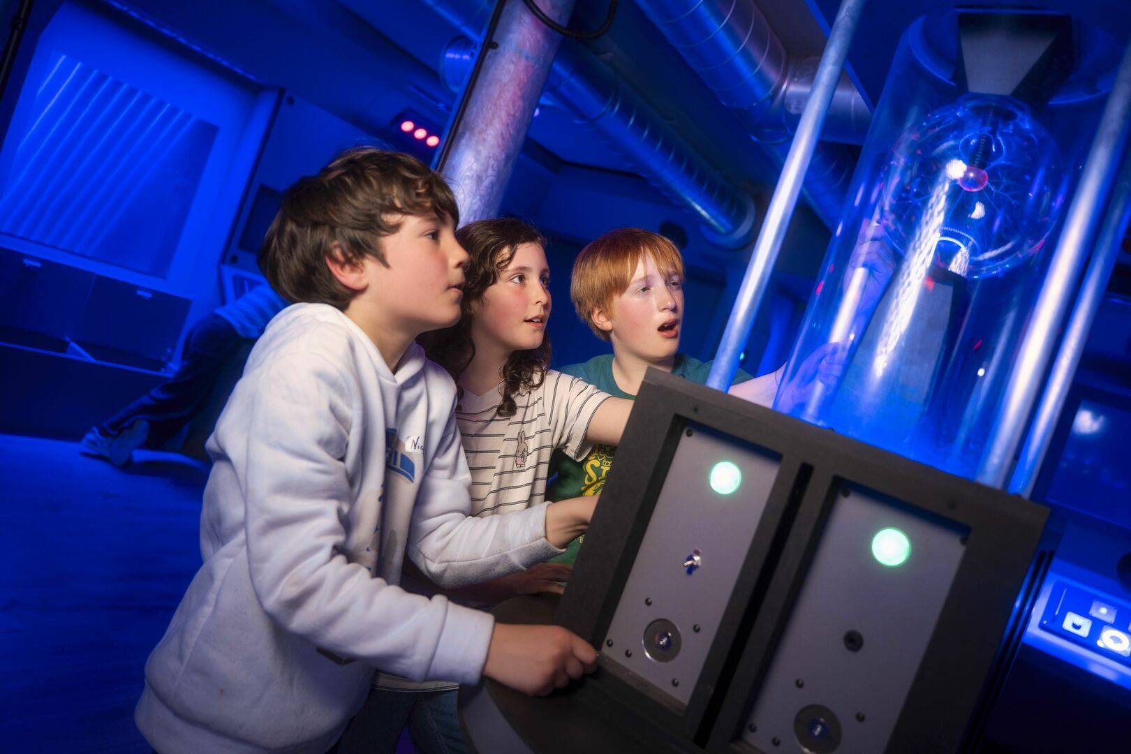 group of kids trying to solve Team Machine escape room problem