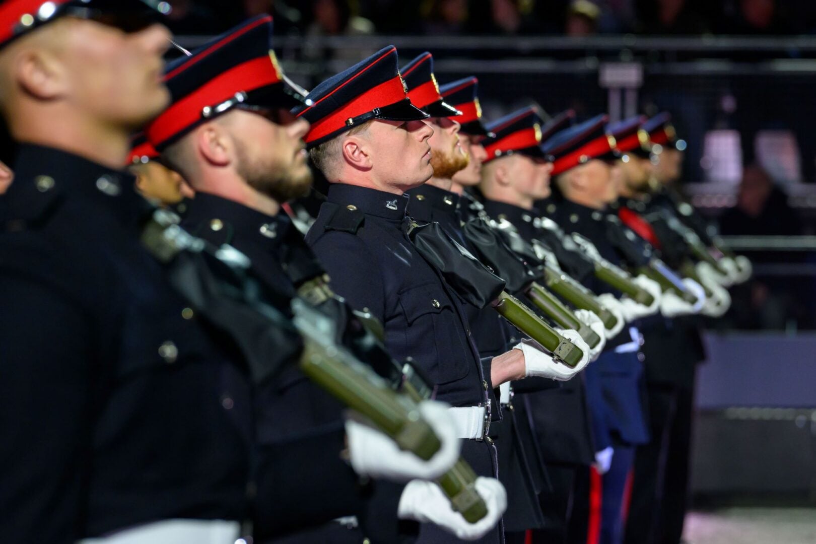 Side-view of soldiers standing to attention.