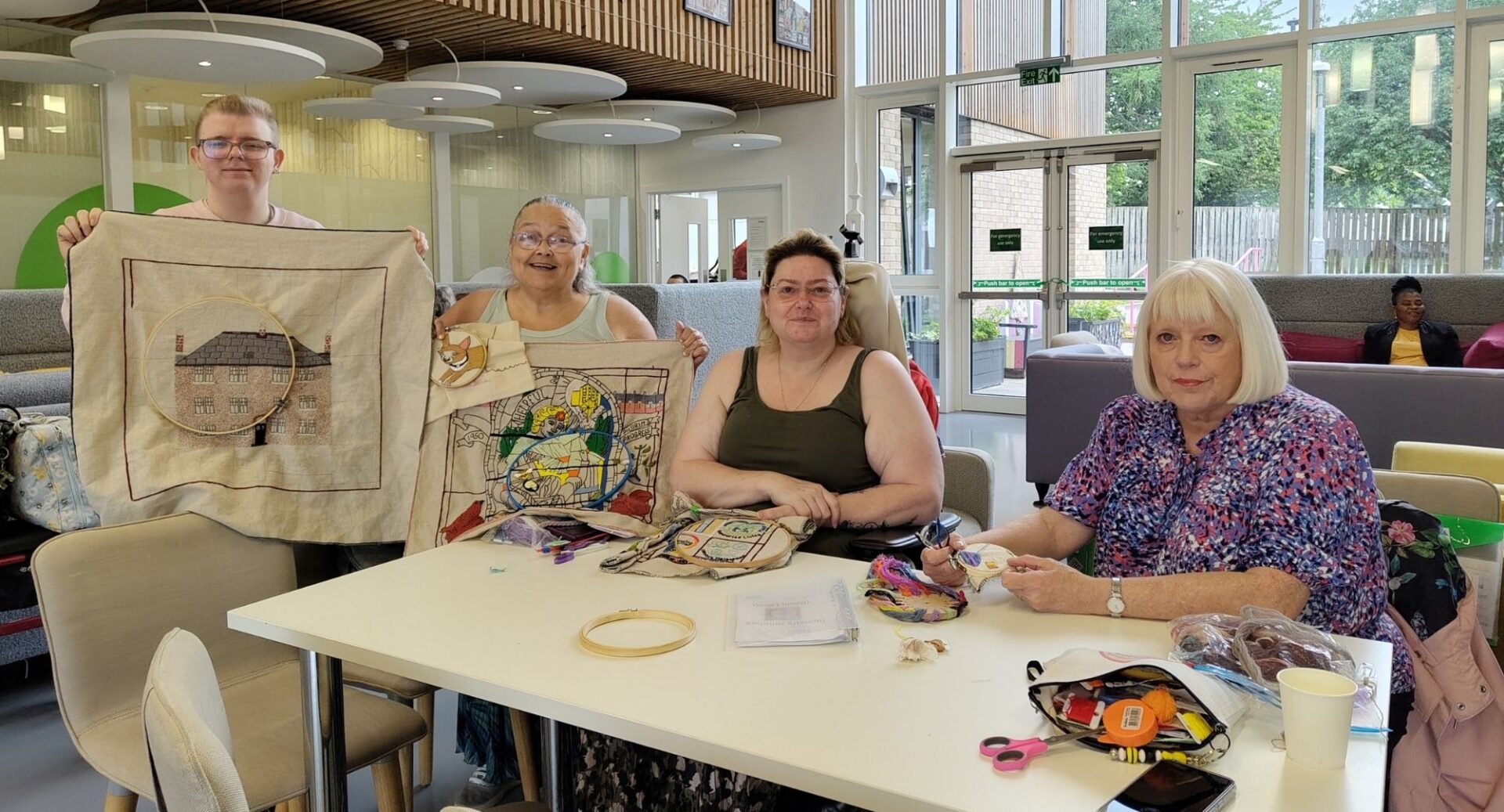 A group of people taking part in a tapestry workshop at the Scottish Storytelling Centre