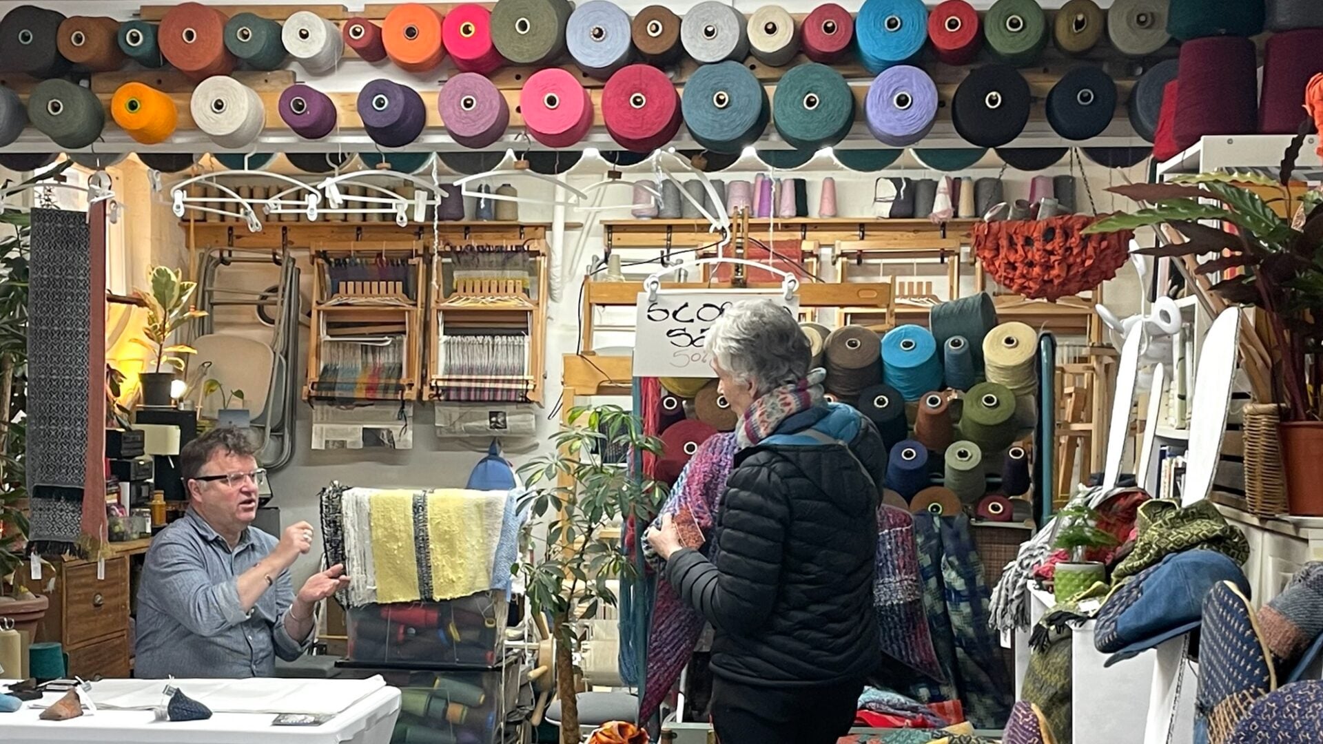 A visitor speaks to an artist at the Open house event at Coburg House