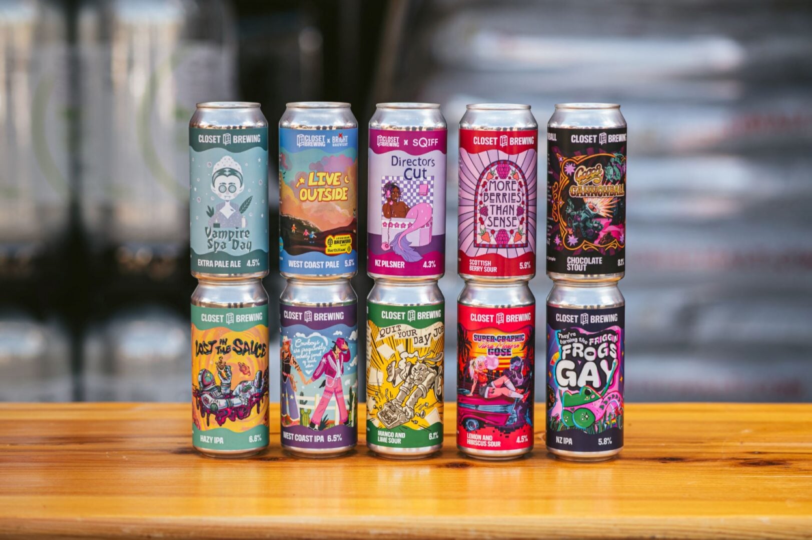 10 cans of beer, with brightly decorated labels.
