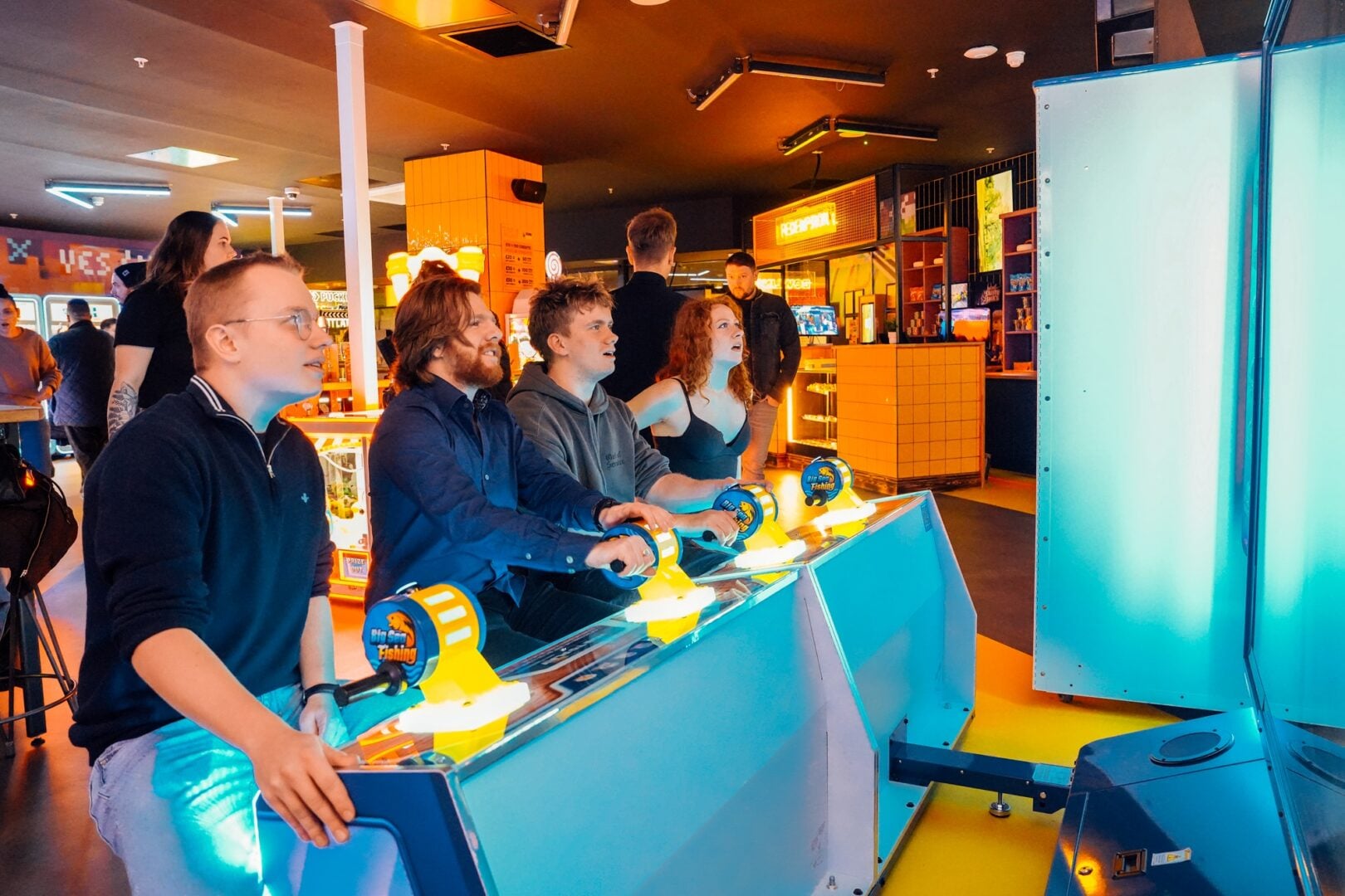 People playing arcade games at King Pins