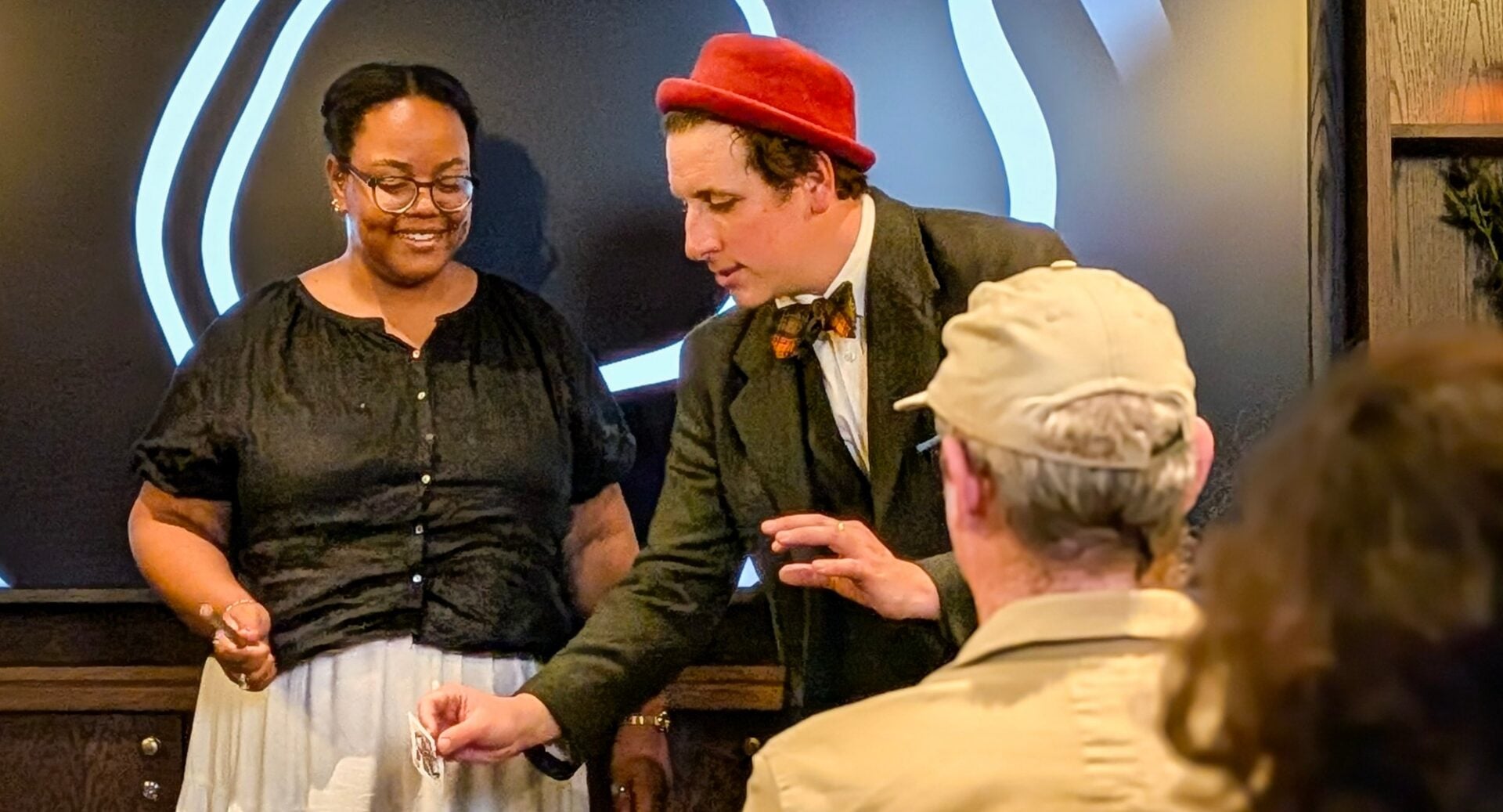 Magician performing for group of people