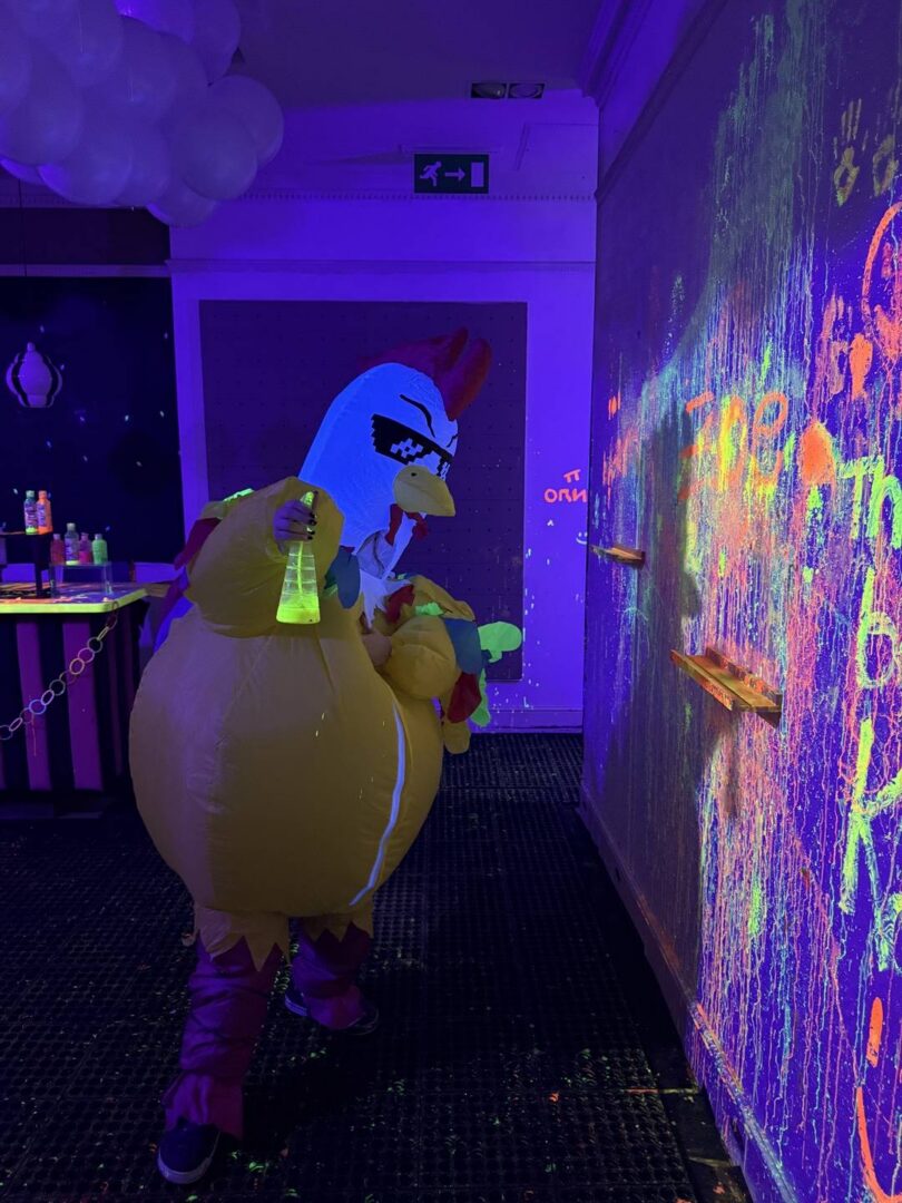 Someone wearing an inflatable chicken suit during one of our inflatable sessions.