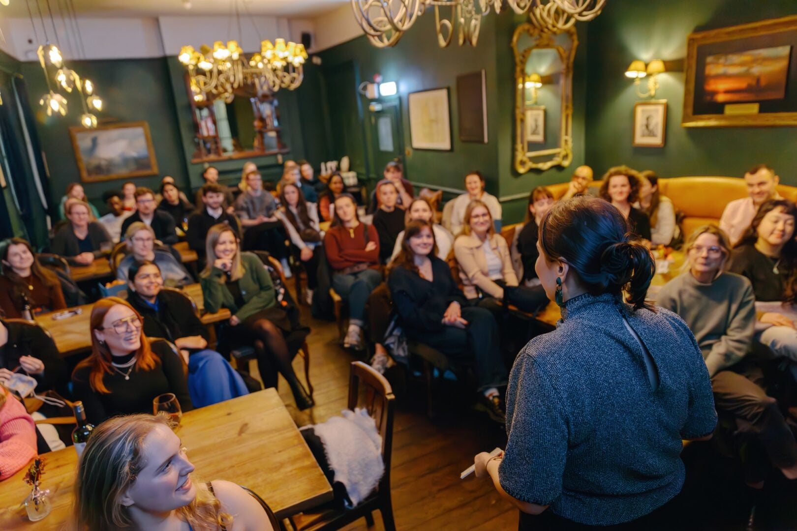Pints of Knowledge Speaker with audience in background.
