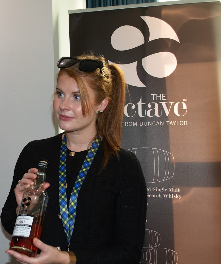 Lady with a bottle from The Octave at Edinburgh Whisky Festival