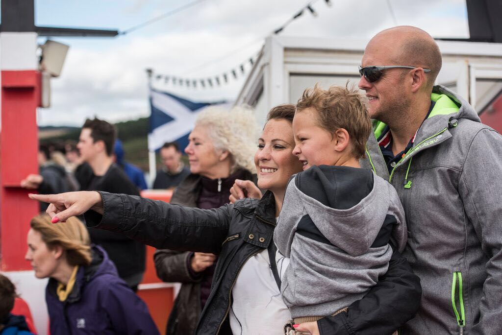 Family on Maid of the Forth boat looking out to sea