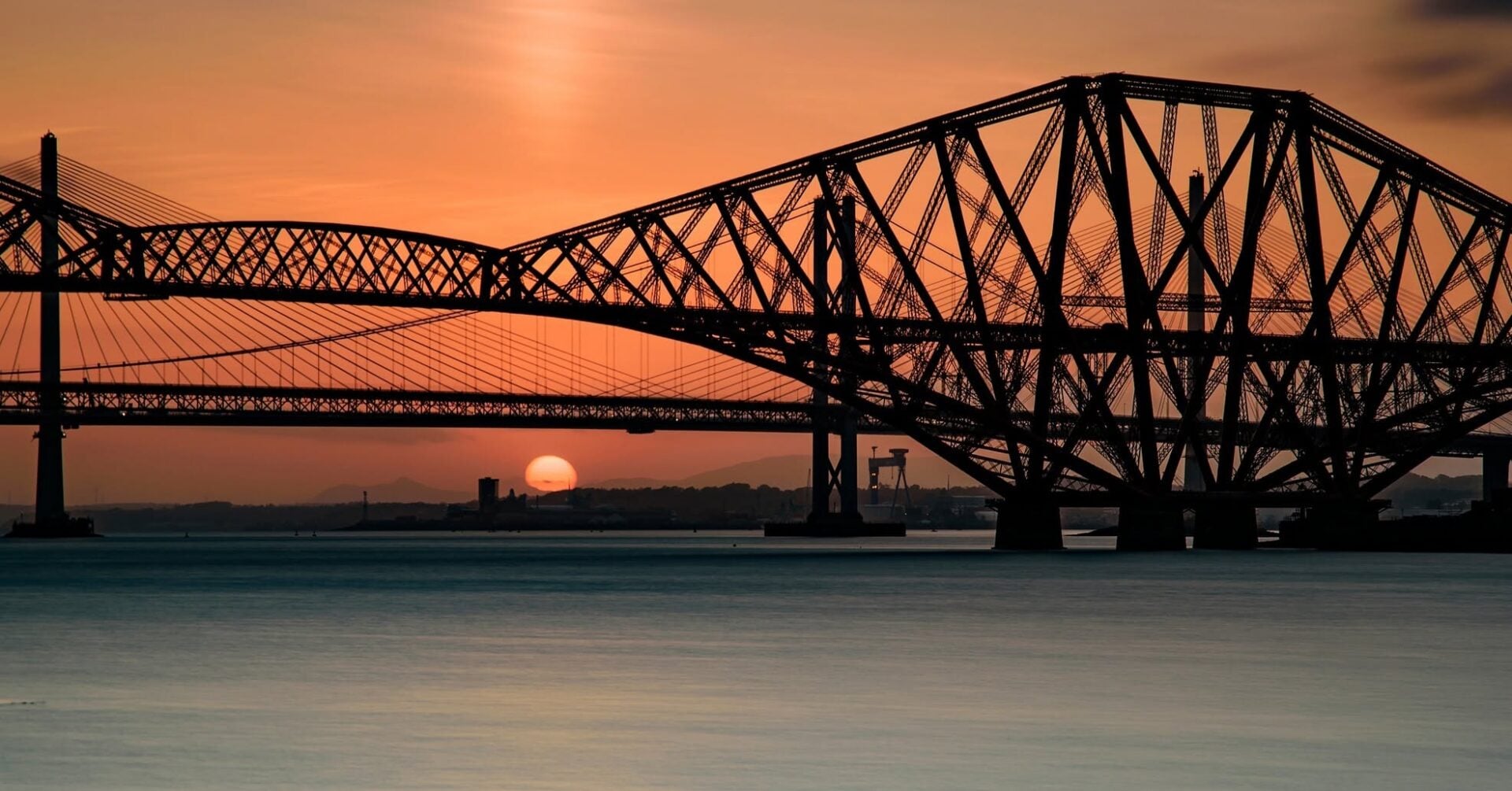 Sunset behing Forth Bridge from maid of the Forth boat