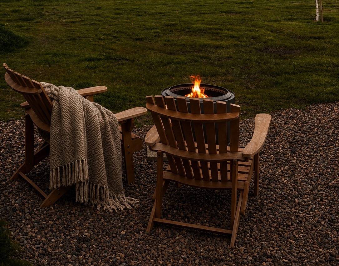Lounge chairs & fire burning in hot pit.,© Pentland Shepherd Huts