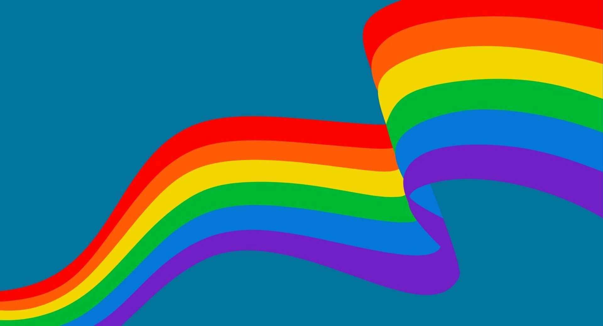 A bright rainbow against a dark blue background.