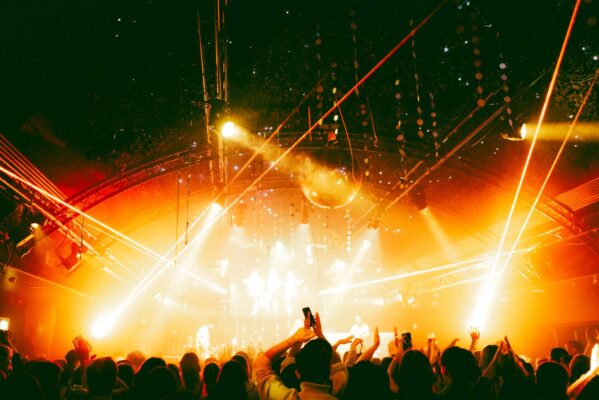 Crowd looking towards a stage with band playing