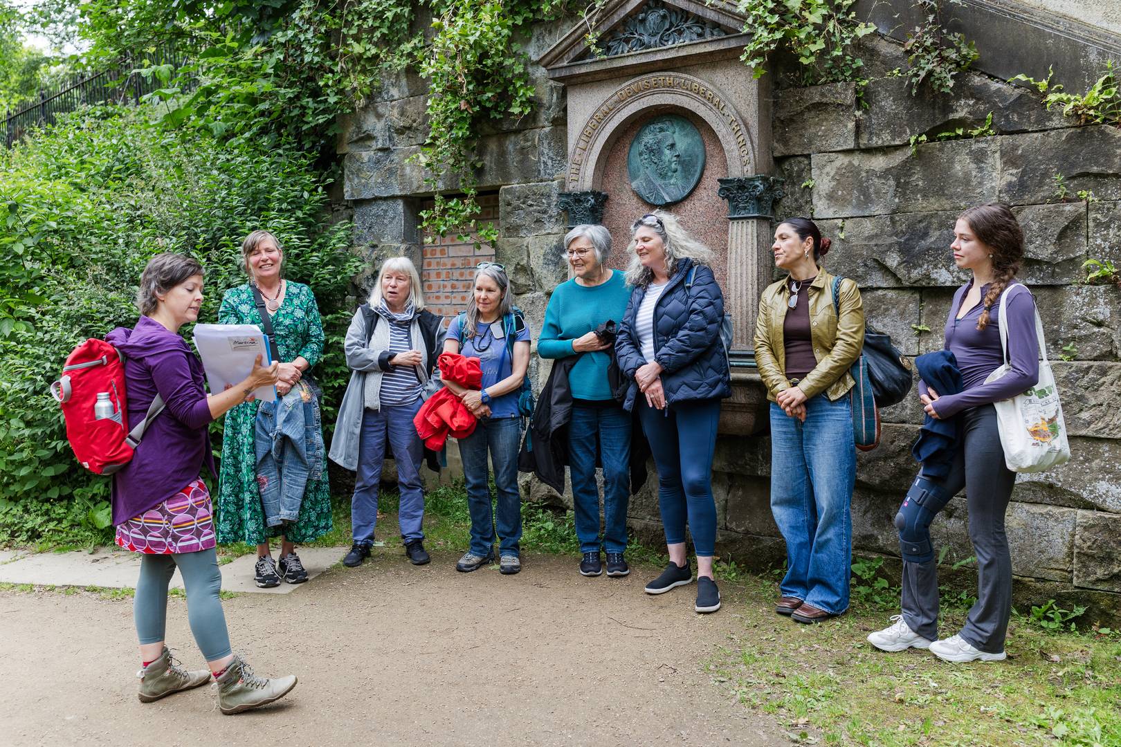Guide showing photos standing near St Bernard's Well in Stockbridge Edinburgh,© Women in Travel CIC