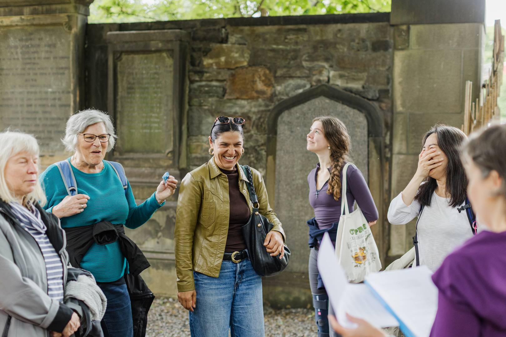 Guide standing near The Parish Church of St Cuthbert in Edinburgh,© Women in Travel CIC