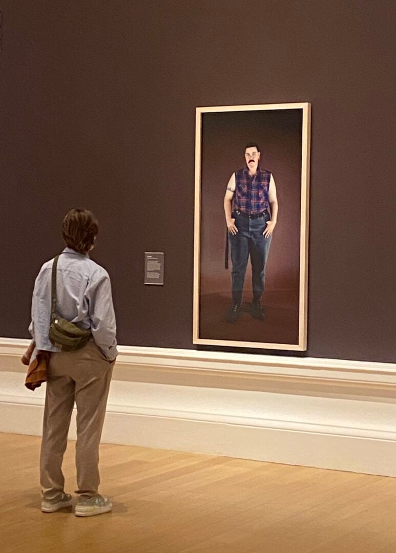 Lady looking at Catherine Opie pictures