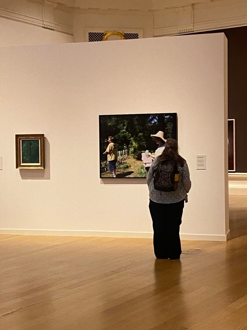 Lady looking at images at Catheriene Opie exhibition