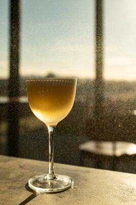 Cocktail looking out of window at Port of Leith Distillery