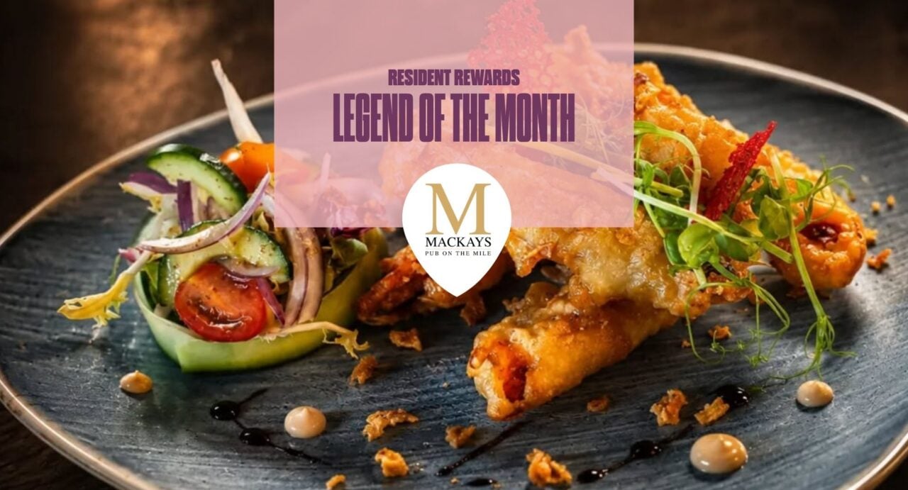 Mackay's on the Mile plate of spring rolls. There is a pink box with writing saying Resident Reward Legend of the Month and Mackay's on the Mile logo.