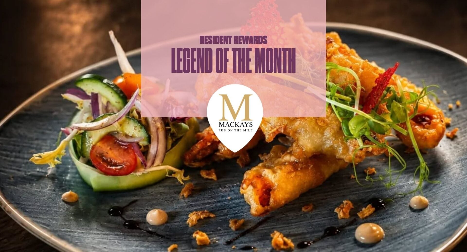 Mackay's on the Mile plate of spring rolls. There is a pink box with writing saying Resident Reward Legend of the Month and Mackay's on the Mile logo.