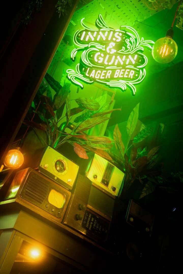 Innis and Gunn neon sign and vintage radios inside Slainte Mhath,© Old Town Pub Co