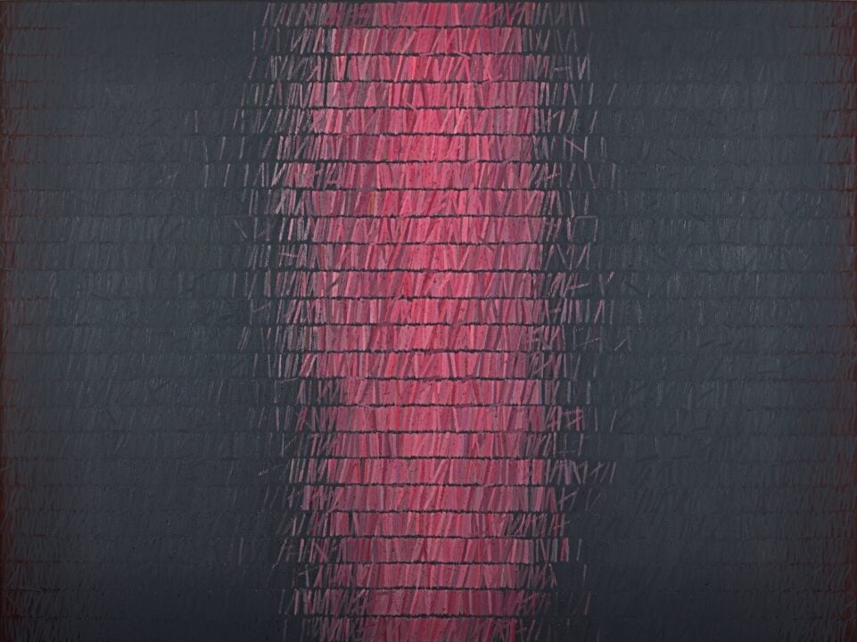 Image of red and black tiles on a wall.
