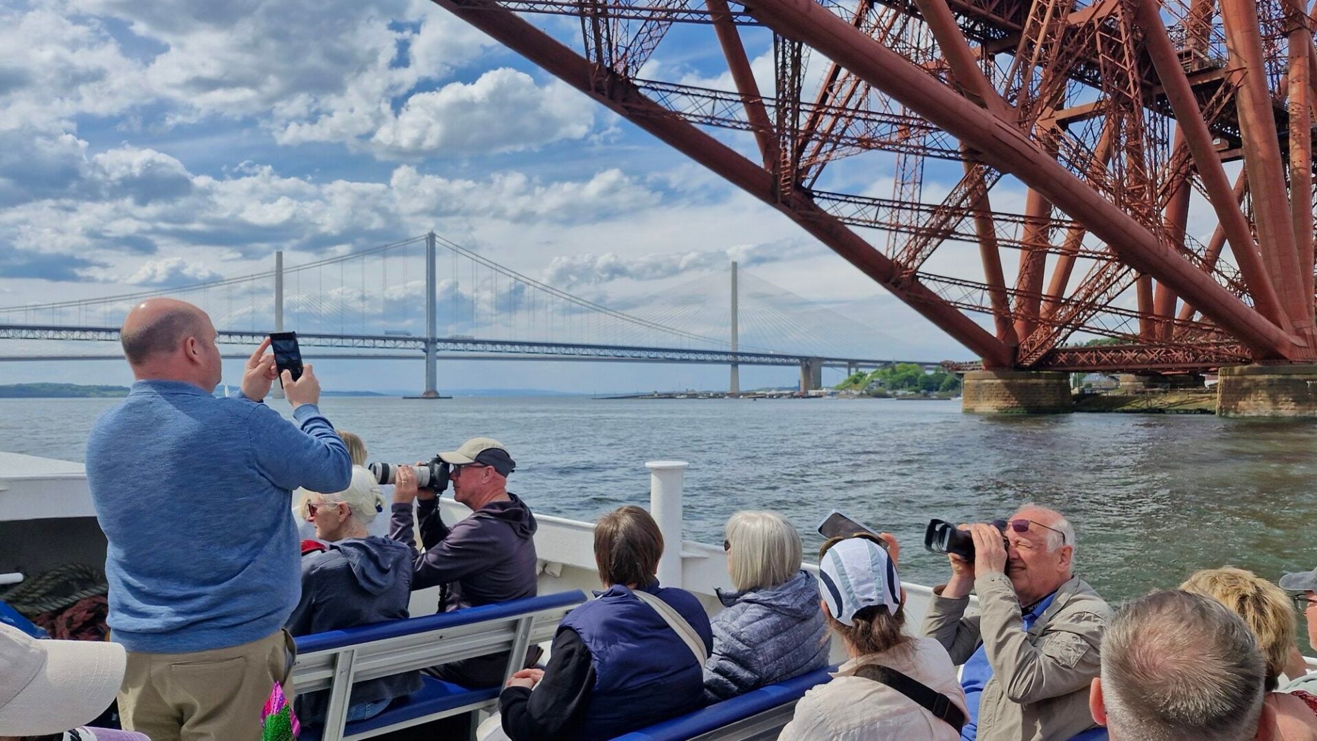 Forth Boat Tours boat with Forth Bridge