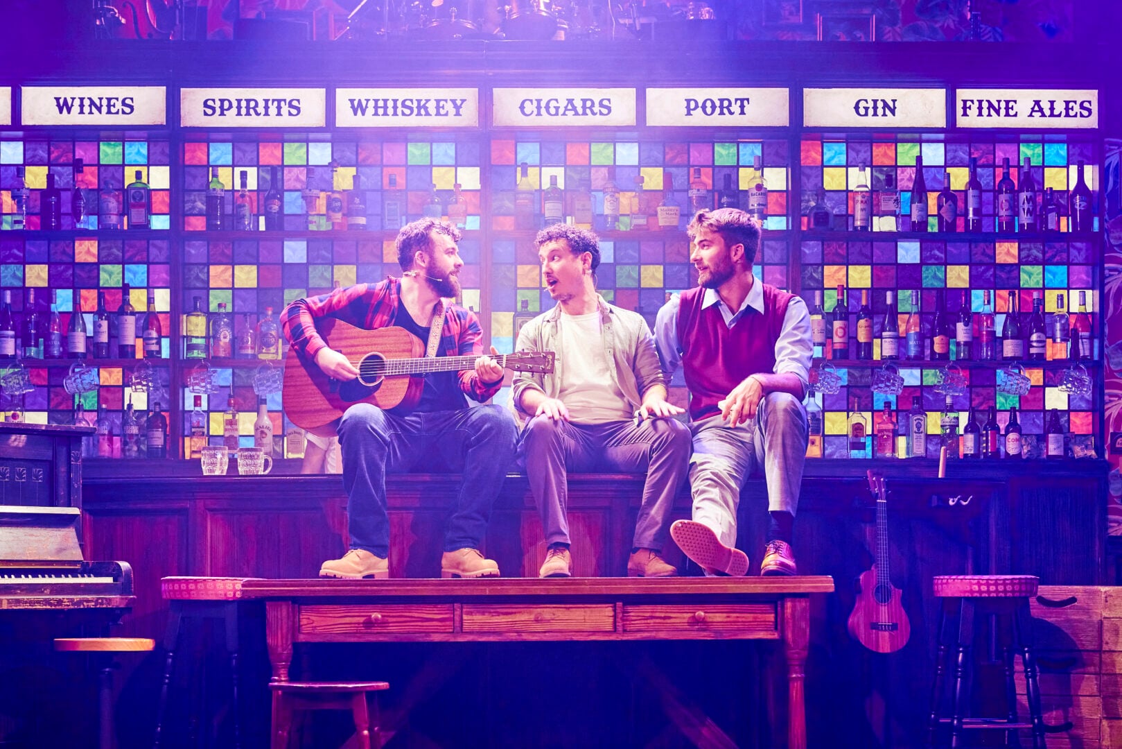 Three men with instruments singing