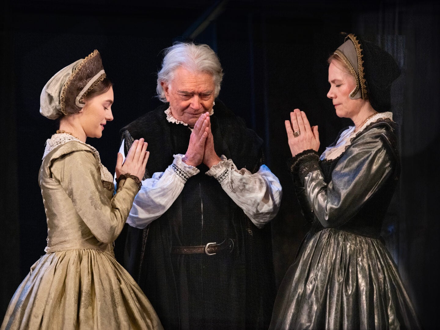 A man and two woman in old fashioned costumes